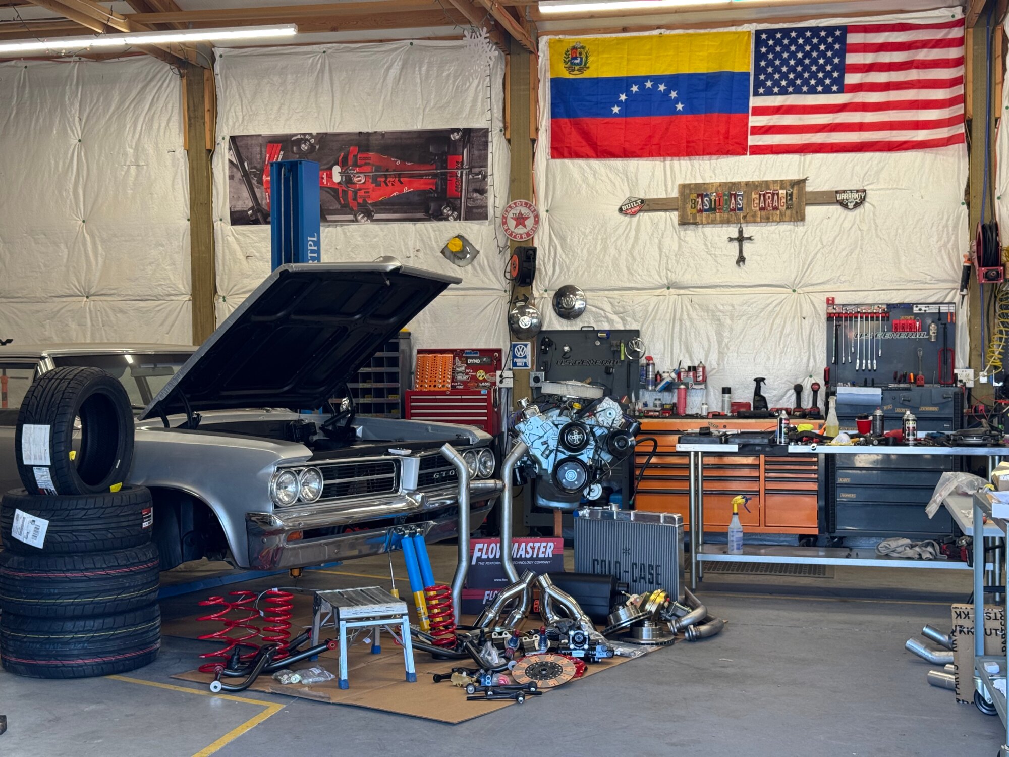 Classic Pontiac GTO being serviced inside Bastidas Garage